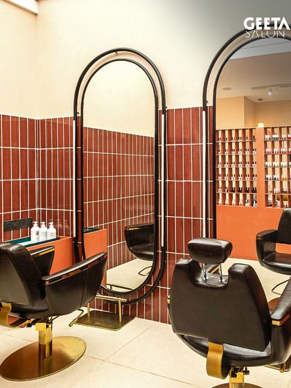 The barbershop at our Shilp Shivalik salon in Ahmedabad features a unique design with retro-inspired chairs and bold tiling, creating a cool, masculine space.