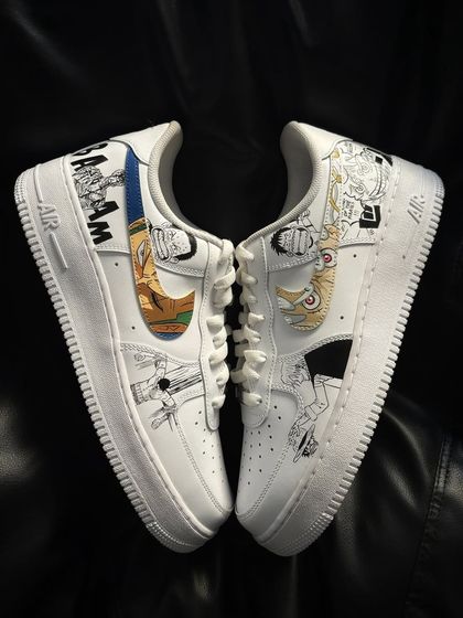 Custom Nike Air Force 1s covered in black and white manga panels from One Piece, featuring iconic moments with Luffy and Zoro.