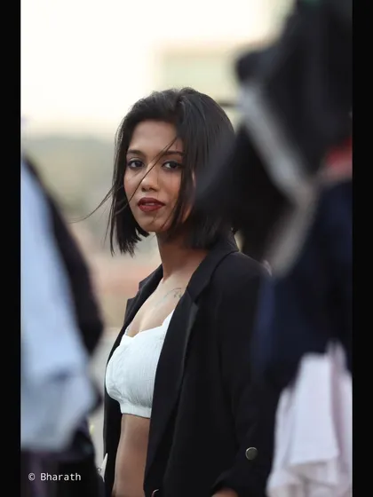 A vertical crop of a similar shot, emphasizing the model's sharp features and modern haircut.