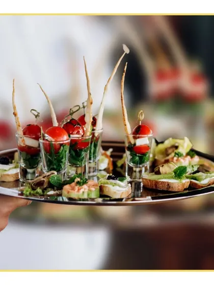 Perfect for mingling, our passed appetizers are designed to be as beautiful as they are delicious. Here, we feature caprese skewers in shot glasses, served on a silver platter by our professional staff for a sophisticated cocktail hour.