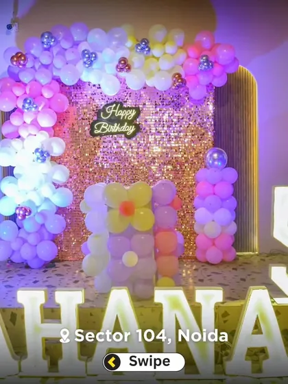A personalized party setup with large, illuminated marquee letters spelling out the birthday girl's name, "AHANA," and the number 5.