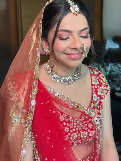 The complete look with the dupatta. Malvika looks absolutely serene with her soft makeup and traditional bridal jewelry.