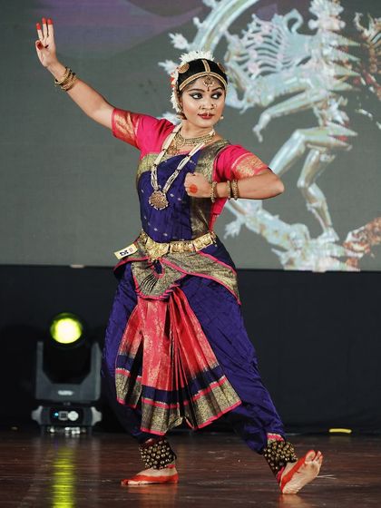 A senior category performer who won 2nd place. Her strong stance and focused expression show her command of the art form.