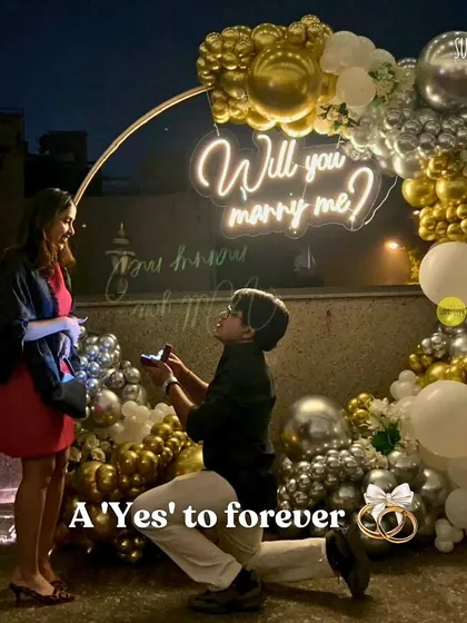 There’s nothing more special than being part of a 'yes' moment. For this rooftop proposal, we created a romantic circular arch with gold and silver chrome balloons and a custom "Will you marry me?" neon sign to make sure the memory would last a lifetime.