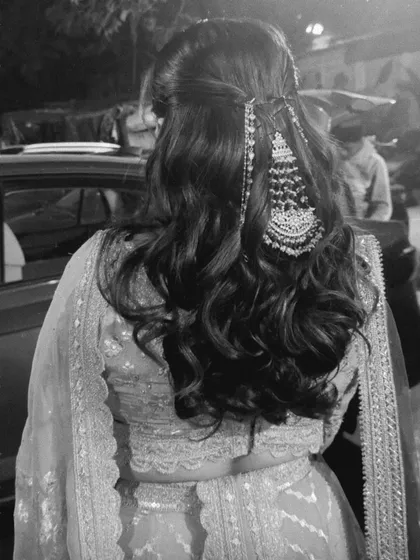 A black and white shot showing the beautiful texture of the waves and the placement of the passa, a traditional side accessory.