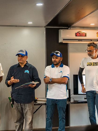 The organizing team and instructors addressing the participants at the EV racing festival. Collaboration is key to making these groundbreaking events a success.