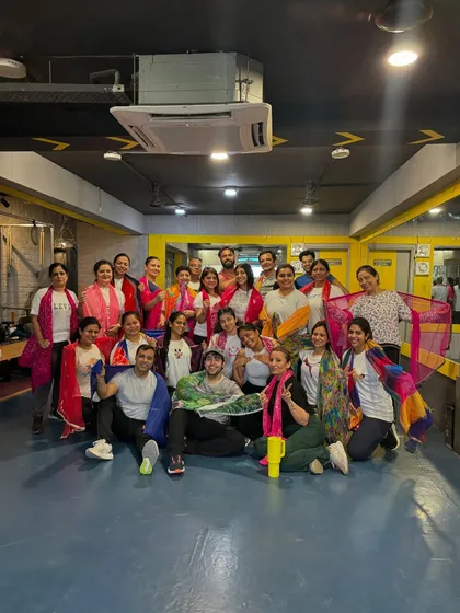 Another shot of our happy, colorful fam after the Holi special class.