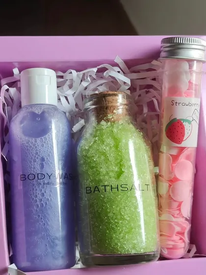 A simple and refreshing gift set with lavender body wash, green apple bath salts, and a tube of travel-sized soap petals.