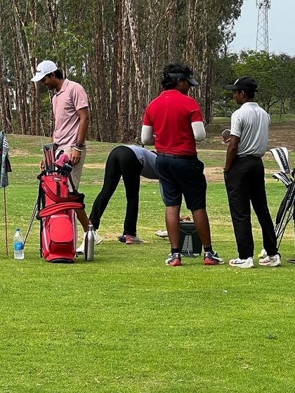 Players and coaches huddle on the practice green. The grind is constant, and it motivates all of us to get better every single day.