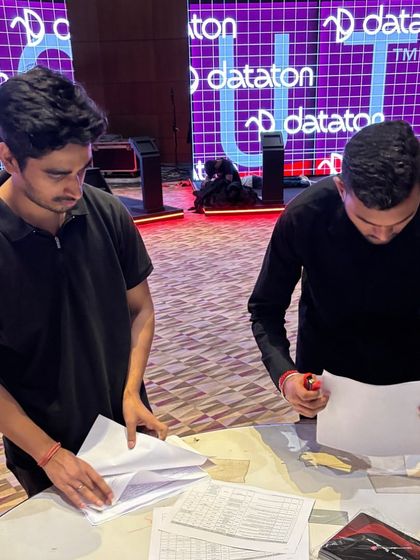 Our team sorting through paperwork and show schedules. Organization is fundamental to our process.