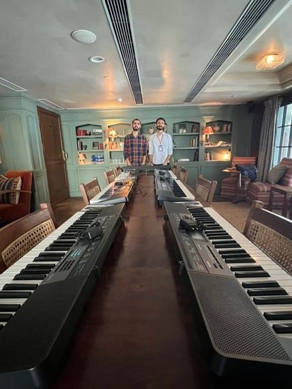 The calm before the storm! Our mentors setting up a long table of keyboards, getting ready for a full house at our Soho House workshop.