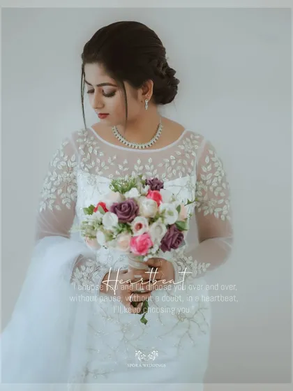 A stunning portrait of the bride holding her bouquet, the text overlay speaking of a love that is like a heartbeat.