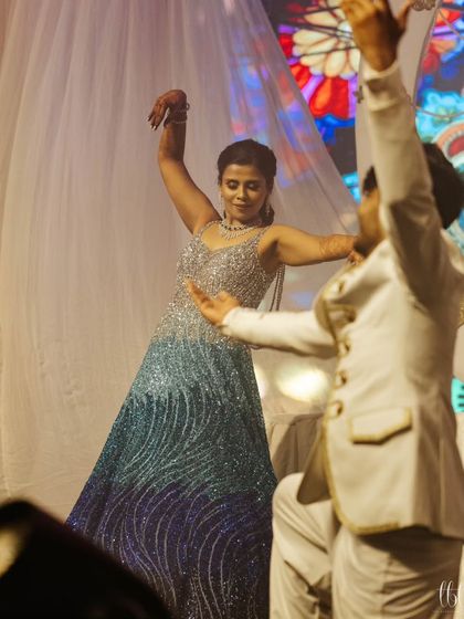 A graceful mother-son dance, a beautiful moment shared on the sangeet stage.