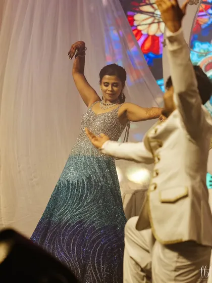 A graceful mother-son dance, a beautiful moment shared on the sangeet stage.