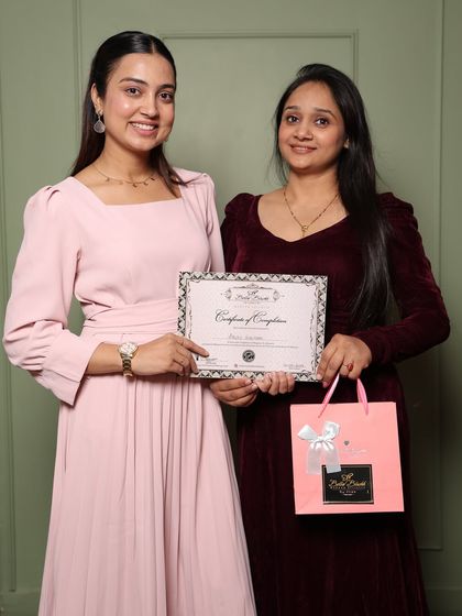 Anju proudly holding her certificate. She had a bad experience at another academy but found her confidence and skills with me.