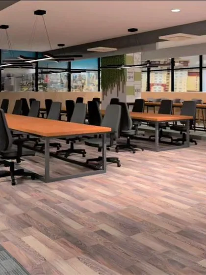 This open-plan office was designed to foster collaboration and productivity. The layout includes varied work zones, from long communal tables to high-top counters, ensuring a flexible and dynamic environment for a modern workforce.