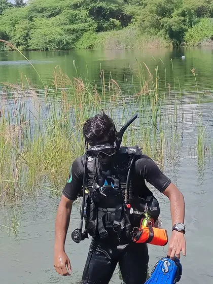 Here I am fully equipped with my scuba gear, including my dive computer and torch, ready for a training session. Practicing in different environments like this quarry makes us better and more adaptable divers.