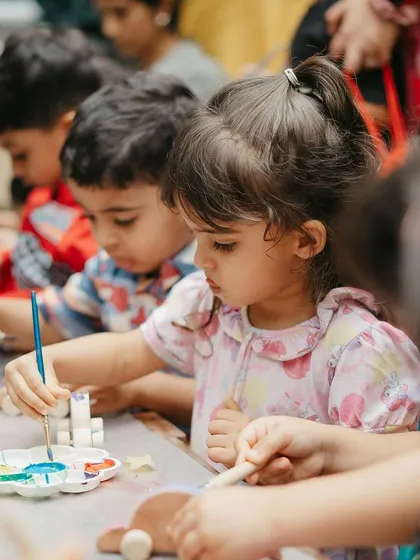 This is the magic moment. We provide all the supplies and a little guidance, then watch as each child gets completely absorbed in their own creative world.