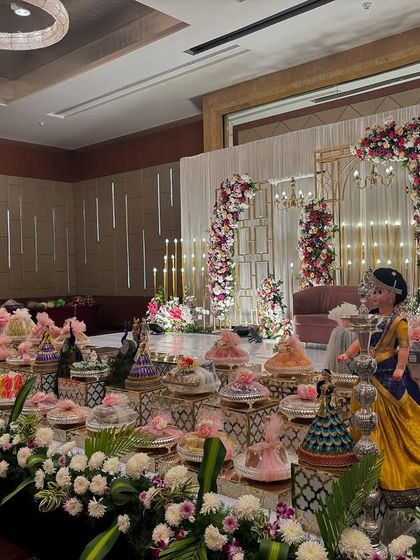 Another side view of the geometric stage, focusing on the detailed offering table.