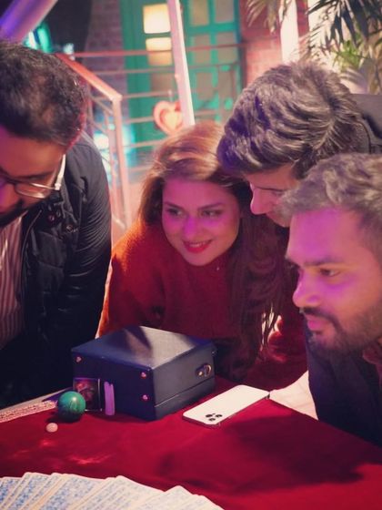 A group of curious and engaged clients at a private event. Group readings are a fun and interactive way to introduce people to the wisdom of tarot.