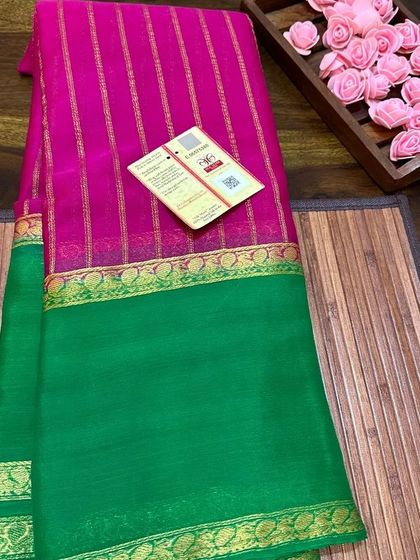 A rani pink and green wrinkle crepe saree, a classic South Indian color combination.