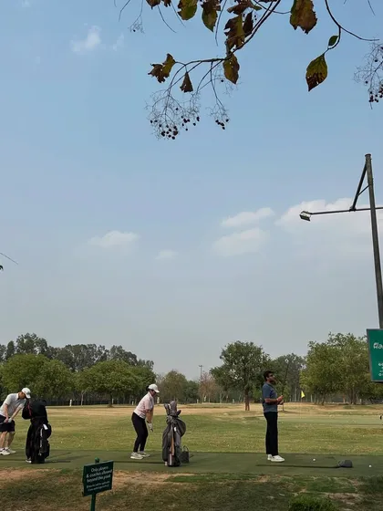 A group of friends practicing together, with a coach observing and offering guidance.