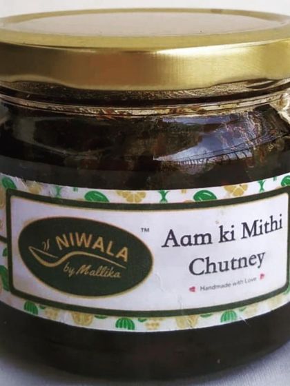 A jar of my classic Aam ki Mithi Chutney. This is a versatile condiment that pairs well with parathas, snacks, or as a side with any meal.