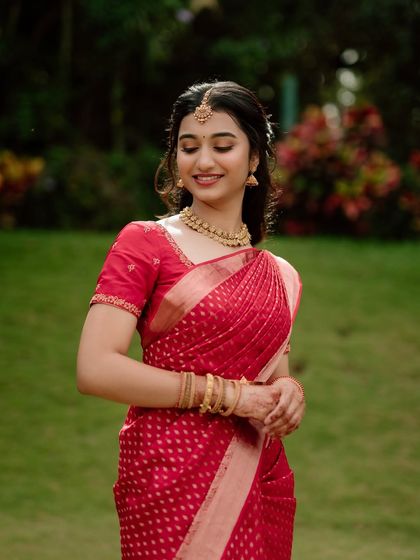 This portrait showcases the simple elegance of the engagement look. The makeup is minimal and fresh, perfect for a daytime event.