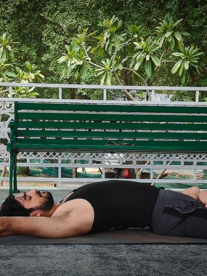 This is Supta Padmasana, the Lying Down Lotus Pose. It expands the chest to increase lung capacity and improves flexibility in the pelvic joints, making it a great restorative asana.