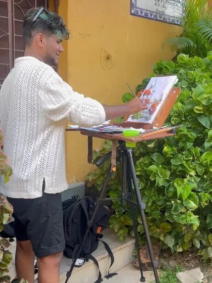 Another shot of me at my easel in Fontainhas, adding details to my watercolor piece.