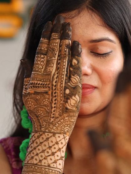 That feeling when the mehendi is on and you're officially a bride-to-be. This is a great pose to incorporate into a bridal solo or pre-wedding photoshoot.