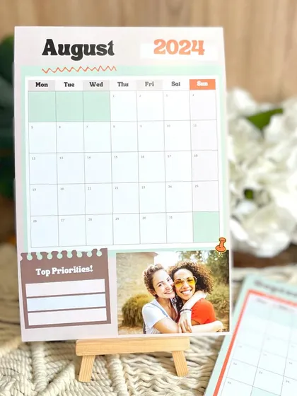 The August 2024 page of my planner calendar, displayed on a mini easel. It's a great addition to any desk, keeping you organized and motivated.