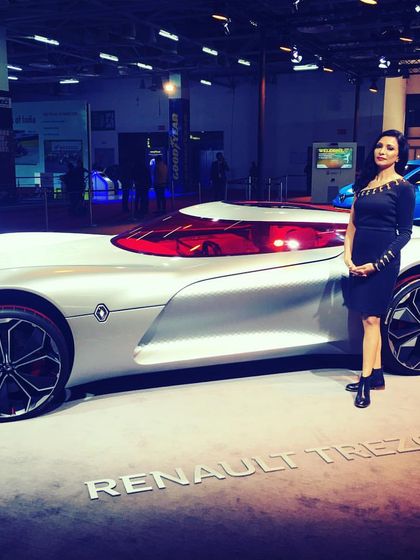 Posing with the futuristic Renault Trezor concept car at the Auto Expo. Hosting at major auto shows requires bringing high energy and passion to match the excitement of the new technology on display.