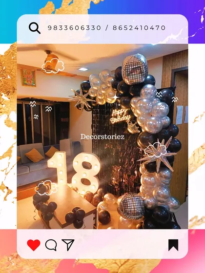 A dynamic shot of an 18th birthday party, featuring a black and silver balloon arch, disco ball foils, and large light-up marquee numbers.