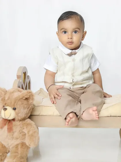 A serious and handsome portrait of this nine-month-old. It's amazing to see their little personalities already shining through.