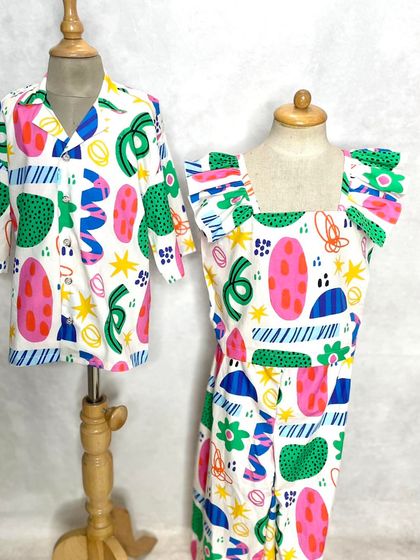 Fun and festive looks for siblings. This abstract "Fun Shapes" print is available as a shirt for him and a playful co-ord set for her.