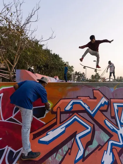 A moment where art and action meet. A skater jumps over a section I'm painting, showing the dynamic environment of a live public art project.