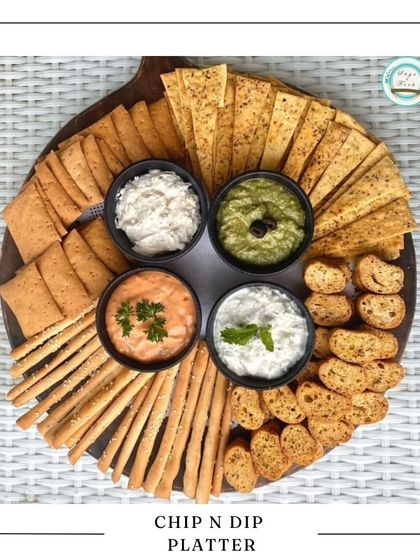 Our Chip and Dip Platter is perfect for casual get-togethers. It features an assortment of crispy crackers, lavash, and chips served with four different freshly made dips, including hummus and creamy yogurt-based options.