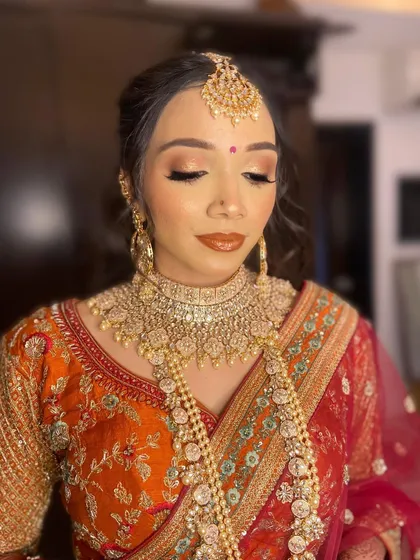 Another angle of Purva's flawless bridal makeup, highlighting the perfect skin finish and the rich color palette used.