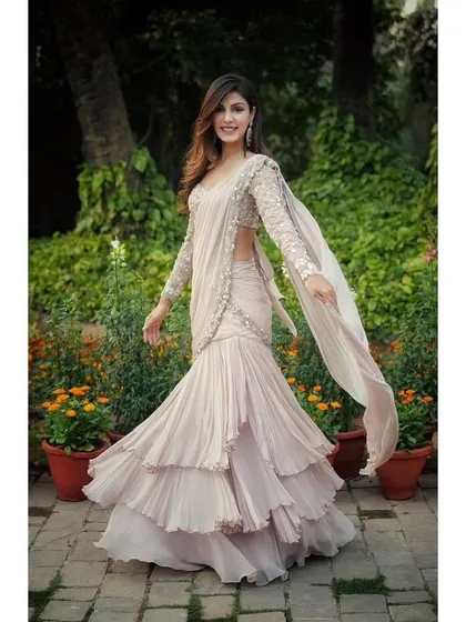 A full, joyful shot of the ruffled Shloka Khialani saree, showing its beautiful movement and modern design.
