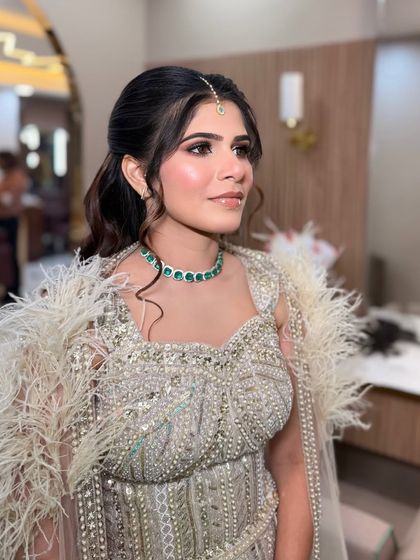 A side profile showing the beautiful soft makeup and the elegant updo. It's a look of pure sophistication.