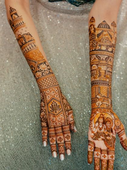 A side-by-side view of both arms, showing the complete narrative of the design, including the Shiva-Parvati portrait.