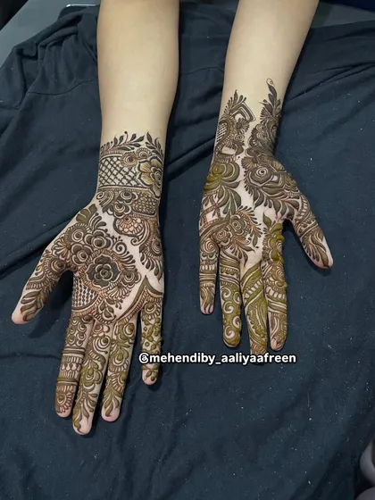 A design that combines a detailed wristband with a lighter pattern on the hand.