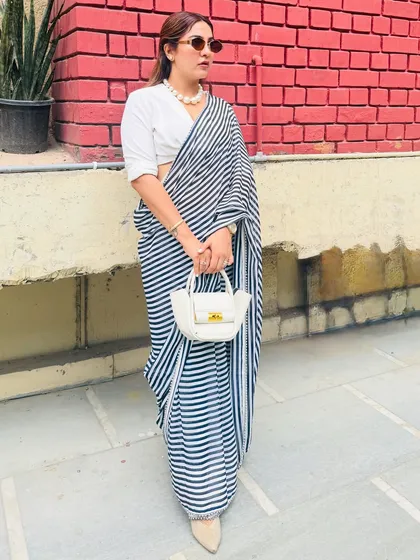 Another angle of my restyled trousseau saree. This look proves that you don't need new clothes to create a fresh look. It's all about creative styling and knowing how to mix and match pieces.