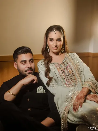 An elegant portrait of Anisha and Abhishek from their Roka, her looking at the camera while he gazes at her.