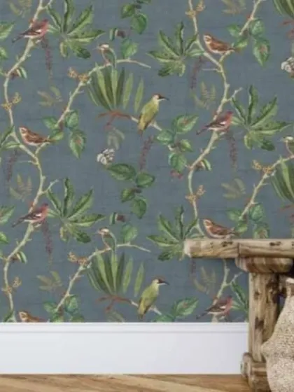 A bird and vine pattern wallpaper in a sophisticated dark blue colorway. This design is perfect for creating a cozy and elegant study or bedroom.