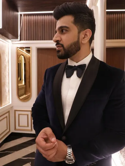A real client moment. For his sister's wedding, he needed an outfit that was both classic and memorable. We crafted this suave, bespoke black velvet tuxedo to ensure he looked his best for the special occasion.