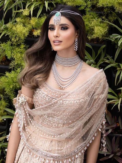 The same look as image 26, but this close-up shows the beautiful detail of the diamond jewellery and the soft, shimmery makeup.