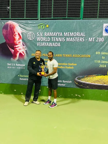 Receiving my singles victory trophy at the ITF MT200 in Vijayawada.