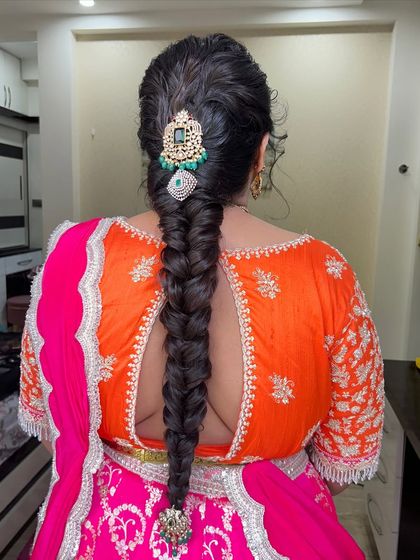Another angle of the elegant fishtail braid, showing its thickness and the beautiful shine of the hair.